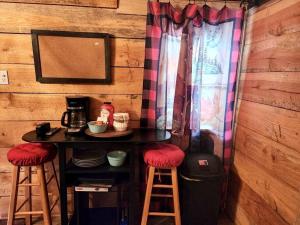 a table with two stools and a table with a coffee maker at Lazy Bear Retreat by the Creek in Pickens +12 photos