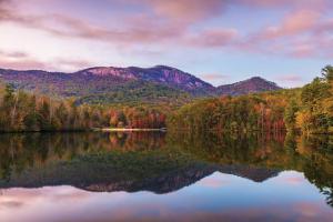 a view of a lake with mountains in the background at Lazy Bear Retreat by the Creek in Pickens