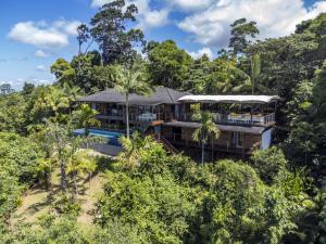 an aerial view of a house in the forest at Stu’s Lookout - 4 Bedroom Use - Stunning Views in Mission Beach