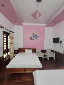 Postel nebo postele na pokoji v ubytování Hostel Ngọc Liên + 13 fotografií