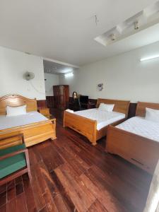 Giường trong phòng chung tại Hostel Ngọc Liên