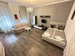 Televízia a/alebo spoločenská miestnosť v ubytovaní City Apartment Hauptbahnhof