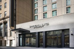 a building with a sign on the front of it at SpringHill Suites by Marriott New York Manhattan Times Square in New York