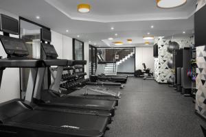 a row of treadmills in a gym with treadleys at SpringHill Suites by Marriott New York Manhattan Times Square in New York
