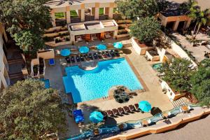 an overhead view of a pool with chairs and umbrellas at San Diego Marriott Mission Valley in San Diego