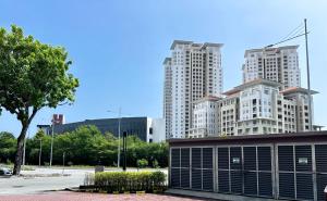 a group of tall white buildings in a city at Jazz Suites Seaview with Bathtub - 1603 in Tanjong Tokong