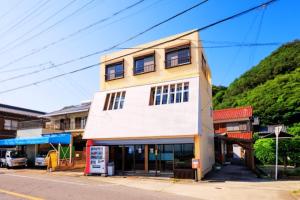 a building on the side of a street at Minamichita Seaside Villa - Vacation STAY 14160 in Minamichita