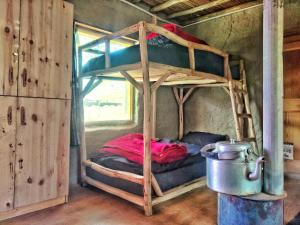 a bedroom with two bunk beds in a room at Spiti Eco Domes in Kaza