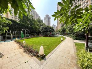 a park with a playground in a city at 1BHK in Hiranandani Powai (E) in Mumbai