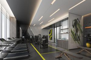 a gym with a row of treadmills and machines at AC Hotel by Marriott Chengdu North in Chengdu