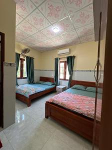 Postel nebo postele na pokoji v ubytování San Vuon Guesthouse + 37 fotografií