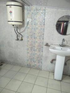 a bathroom with a toilet and a sink at Goroomgo Naina Homestay Near By Landour Clock Tower Mussoorie in Mussoorie