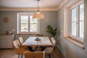 a dining room with a table and chairs at Haus Weitblick in Fieberbrunn