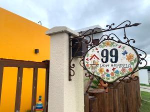a sign on the side of a building at Casa Amarela - Santo Amaro in Santo Amaro