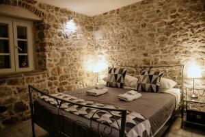 Кровать или кровати в номере City Rooms Šibenik