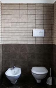 a bathroom with a toilet and a sink at Colle d'Elce in Deliceto