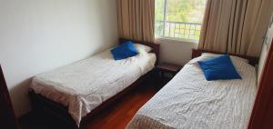 Postel nebo postele na pokoji v ubytování Seaview Condo B63