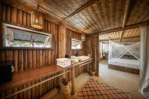 a room with a bedroom and a bed in it at The Beach House Ocam Ocam in Busuanga +269 photos