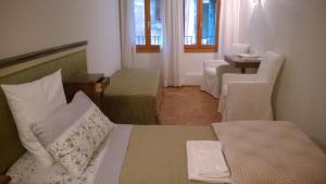 A bed or beds in a room at In Venice Back To San Marco tourist apartment