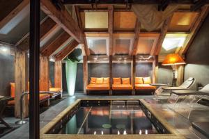 a house with a pool in the middle of a room at Adua & Regina di Saba Wellness & Beauty in Montecatini Terme