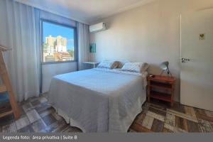 Postel nebo postele na pokoji v ubytování Casa da Cacá