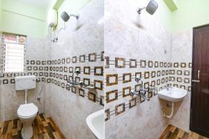 加爾各答的住宿－FabHotel The Sunshine Residency，浴室配有卫生间、盥洗盆和浴缸。