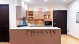 a kitchen with a sign that reads phoenix marketing at Apartment in Islamabad in Islamabad