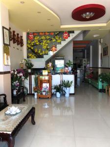 a lobby with a flower mural on the wall at Nam Dương 2 Hotel in Phan Rang