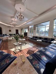 a large living room with a couch and a table at Sara Farm in Abu Dhabi