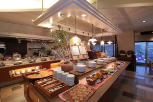 a buffet line with food on it in a restaurant at Odakyu Hotel Century Sagami Ono in Sagamihara