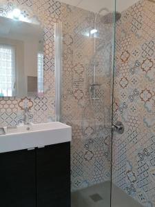 a bathroom with a shower and a sink at Nest of love in San Damiano dʼAsti