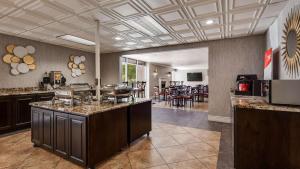a kitchen with a large island in a room at Best Western Plus Abbey Inn in St. George