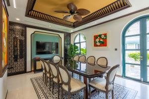 a dining room with a table and chairs at Stella Marina Boutique Hotel in Phú Quốc