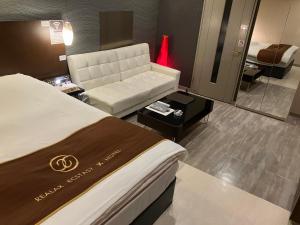 Postel nebo postele na pokoji v ubytování X Hotel - Adult Only-