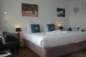 Postel nebo postele na pokoji v ubytování Rotorua Motel + 7 fotografií