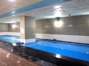 a large swimming pool in a building at High Castle Resort in Jeongseon