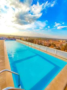 a swimming pool on the roof of a building at Comfy Studio Apartment with Pool in Nairobi
