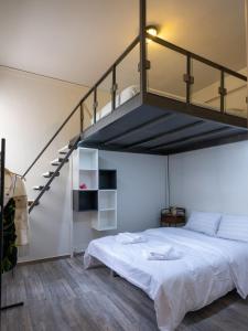 a bedroom with a large bed with a loft at Loft 038 City Center in Heraklio Town