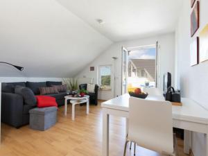 a living room with a couch and a table at Wohnpark Stadt Hamburg Whg Seeluft 29A in Binz