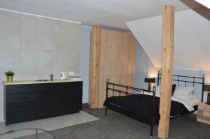Postel nebo postele na pokoji v ubytování B&B Landrynka