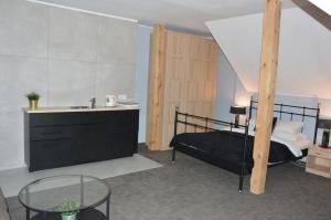 Postel nebo postele na pokoji v ubytování B&B Landrynka