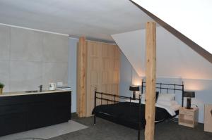 Postel nebo postele na pokoji v ubytování B&B Landrynka