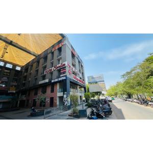 a building with motorcycles parked in front of it at The Berlin in Gandhinagar