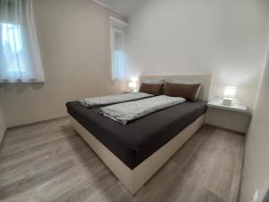 Posteľ alebo postele v izbe v ubytovaní Villa Bori Siófok