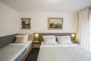 Ένα ή περισσότερα κρεβάτια σε δωμάτιο στο Golden GaPa Central Apartment 4