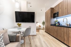 TV a/nebo společenská místnost v ubytování Suite Deluxe Valencia