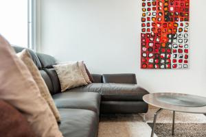 a living room with a couch and a table at Haus Alexander in Meersburg