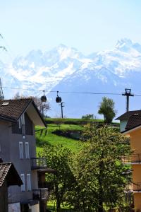 a view of a snow covered mountain in the distance at Lo barbaboc in Aosta