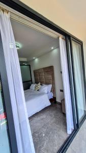 Cama o camas de una habitación en Rads apartment,kileleshwa