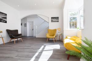 a living room with two chairs and a couch at The Nook - Self Serviced Accommodation in St Ives